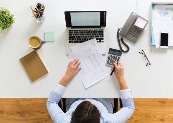 businesswoman with tax report at office