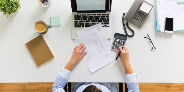 businesswoman with tax report at office