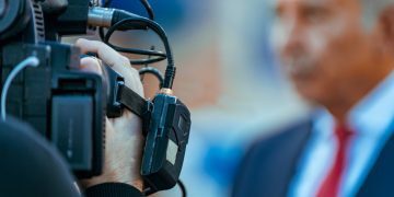 Cameraman Recording Event At Media Press Conference