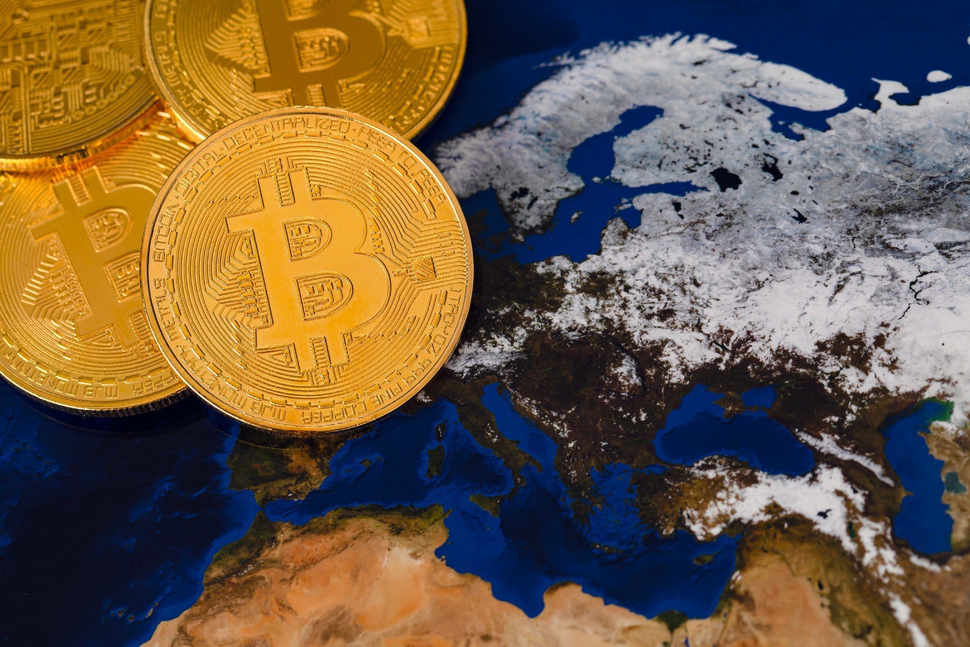 Golden Shiny Bitcoin Crypto Currency Coins On World Map