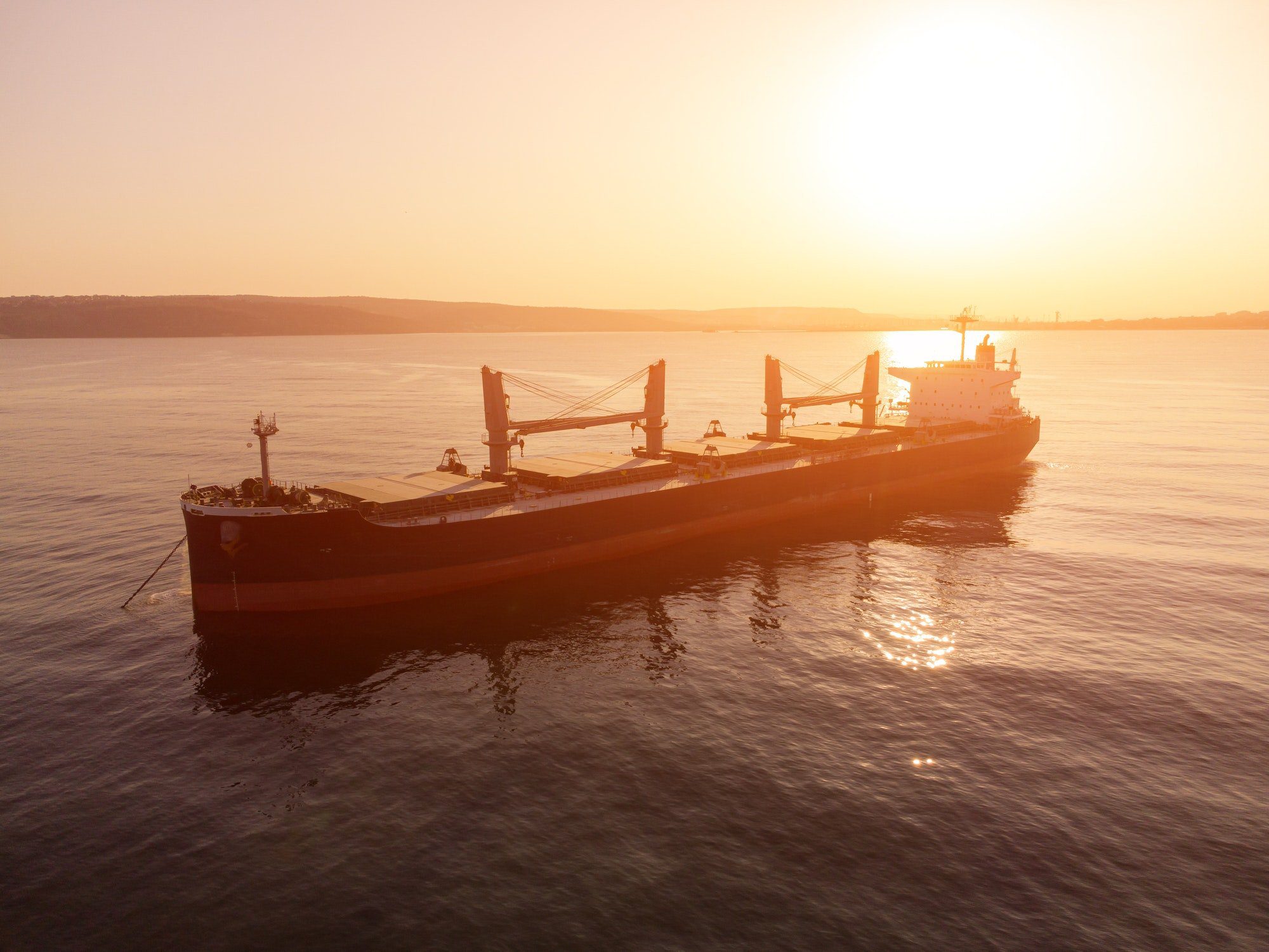 Large general cargo ship tanker bulk carrier, Top down aerial view.