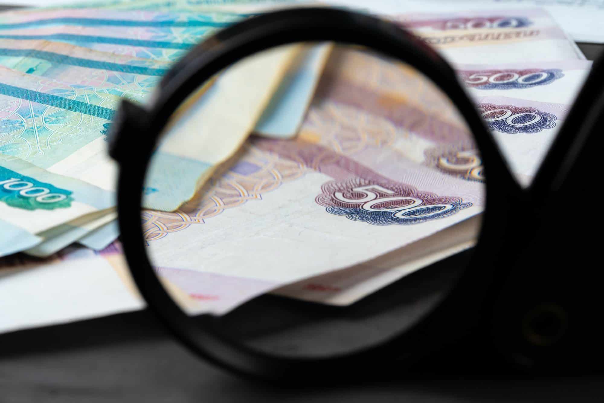 Magnifying Glass on the Russian Currency Rubles