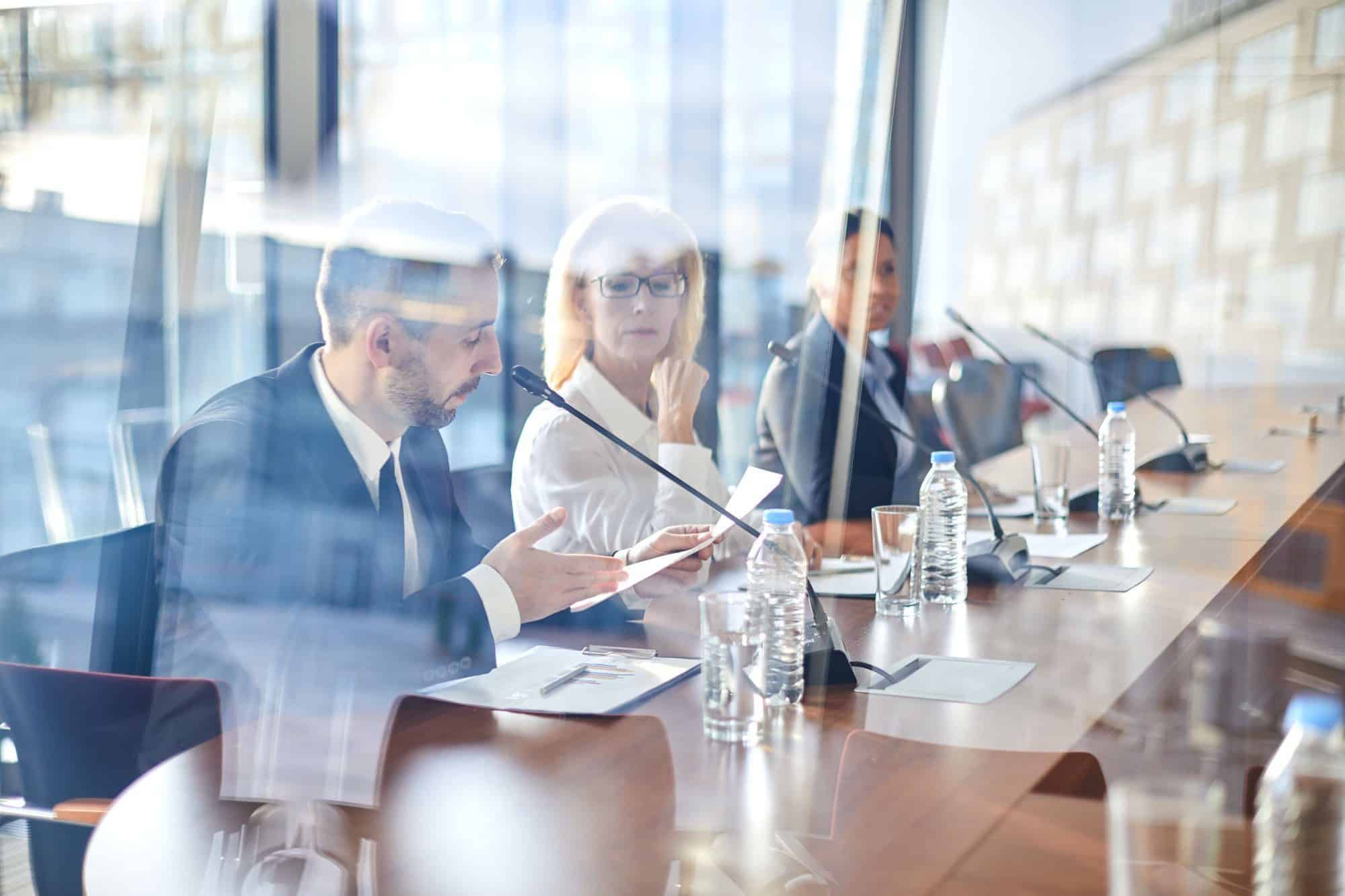 Traders discussing paper