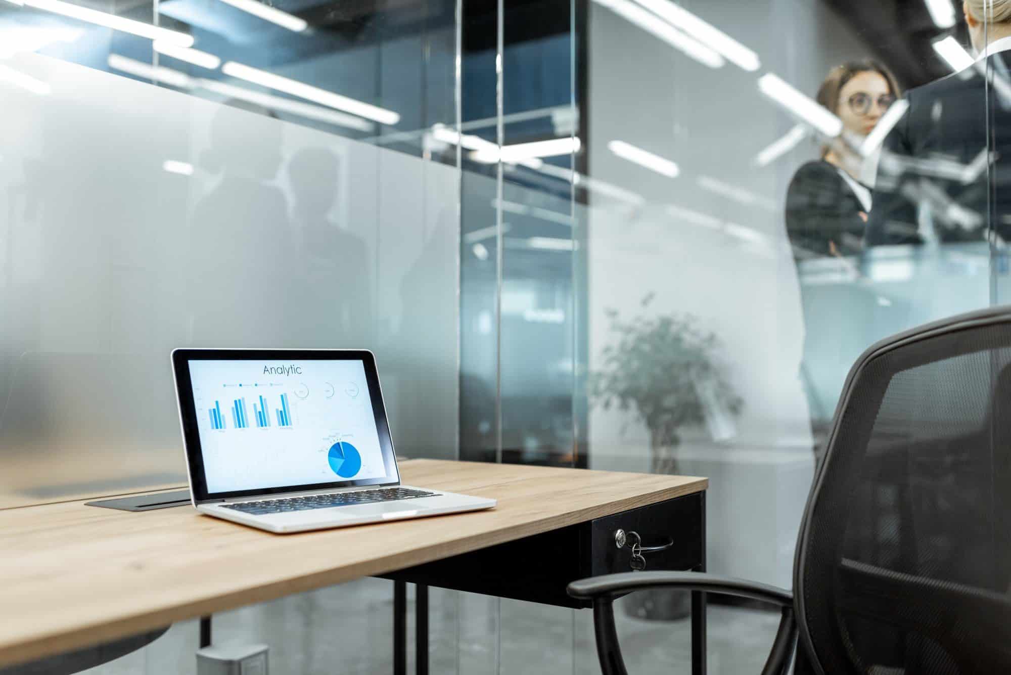 Working place with laptop and chart